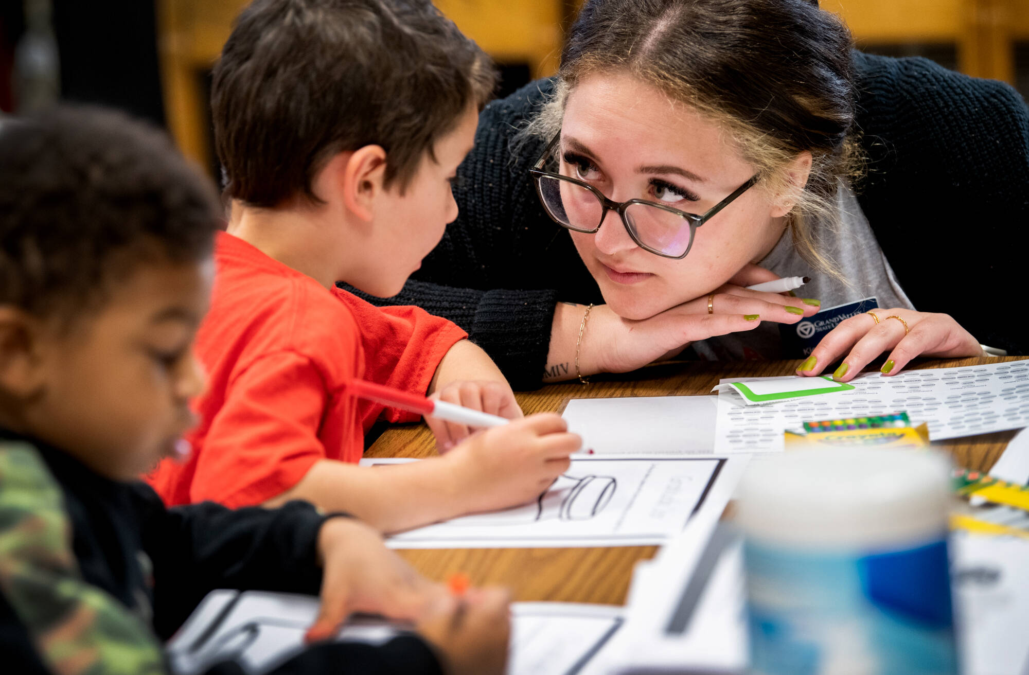 Kiersten Duiven, Master of Public Health student at GVSU, right, works with Stocking Elementary School.